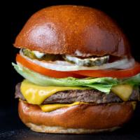 Earth Burger · Vegan Potato Roll, Vegan Cheddar, Impossible Patti, Vegan House Sauce, Mustard, Lettuce, Pic...