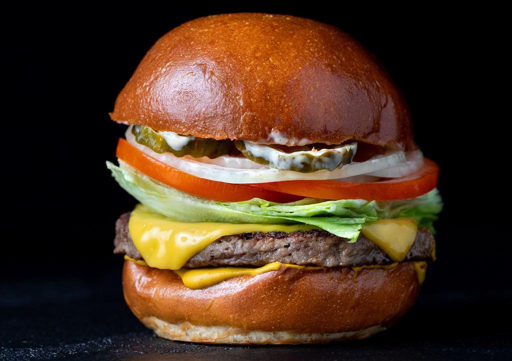 Earth Burger  · Vegan Potato Roll, Vegan Cheddar, Vegan House Sauce, Mustard, Lettuce, Pickle, Onion and Tomato