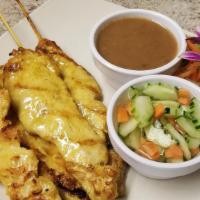 4 Chicken Satay · Marinated chicken in coconut milk and Thai spices on skewered and grilled served with cucumb...