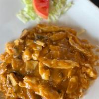 Arroz Con Pollo · Sautéed chicken breast, mushroom, onions in a rich tomato sauce. On a bed of red rice with m...
