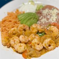 Mariscos A La Diabla · Shrimp sautéed in a pineapple diablo sauce with rajas. Served with red rice, refried beans a...