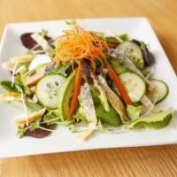 Salmon Skin Salad · Crispy salmon skin on a bed of organic spring mix, w/ avocado, tomato, cucumber, carrots and...