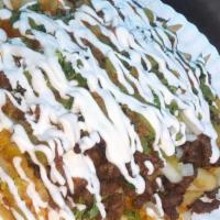 Asada Fries · French Fries topped with cheese, choice of meat, salsa, condiments and sour cream.