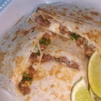 Quesadillas · Flour Tortilla with your choice of meat, as well as condiments and sauce.