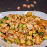 Cashew Shrimp · Shrimp with zucchini carrots and celery stir fried in brown sauce topped with cashews.