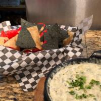 Spinach & Artichoke Dip · Fresh spinach and artichoke hearts mixed with a roasted garlic cream cheese, served with han...