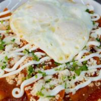 Chilaquiles · Crispy tortilla chips covered in green sauce or red sauce. Topped with queso fresco, sour cr...