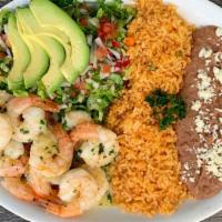 Camarones Al Mojo  De Ajo · Mexican white shrimp marinated in fresh garlic. 
Served with rice, beans, and salad.