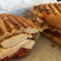 Chipotle Chicken Panini · Grilled chicken breast, pepper jack cheese, caramelized onion, tomato, roasted red bell pepp...