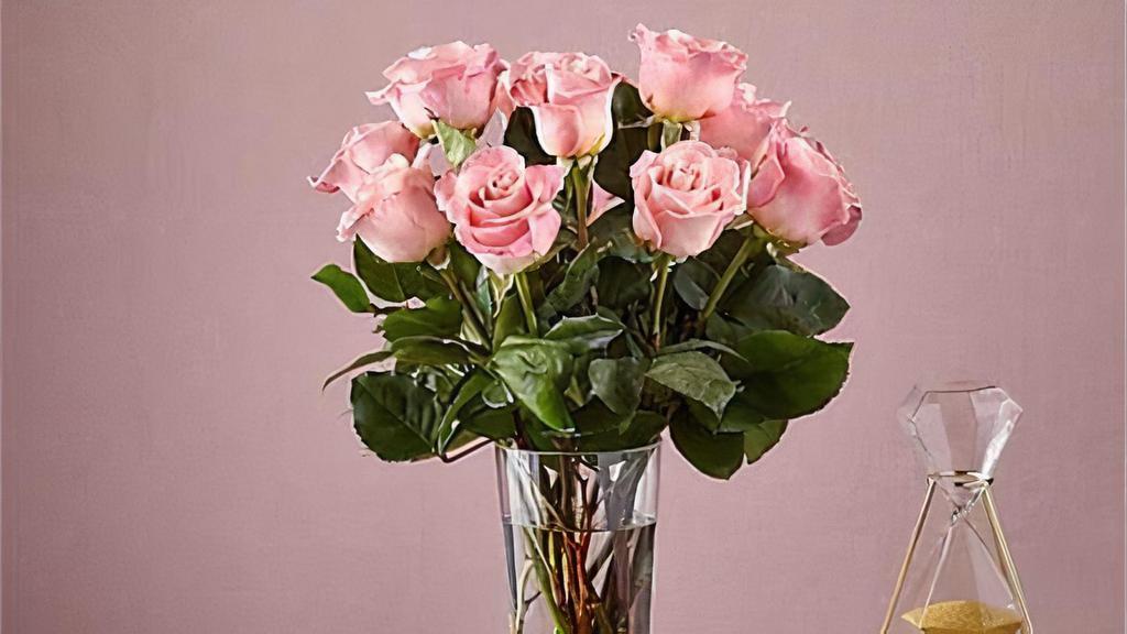 12 Long Stem Pink Roses · Enjoy the classic Beauty of the rose with a playful twist in our Long Stem Pink Rose Bouquet. This arrangement features 12 pink roses that will look especially pretty in the hands of those you cherish most. Vase included. Item # E5440S