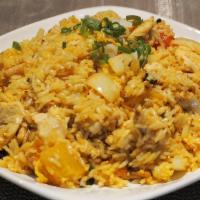 Pineapple Fried Rice · Comes with pea, carrot, white onion, and raisin sautée with eggs and steamed rice.