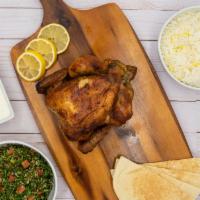 Whole Rotisserie Chicken · Whole Rotisserie Chicken served with your choice of 2 large sides, pita bread and garlic sau...
