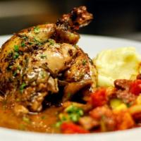 Chicken Main · roasted half chicken, rosemary au jus, served with potatoes and vegetables