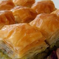 Baklava (15 Pcs.) · Philo Dough Pastry Triangles (15 pcs.) with Walnuts, Pistachios & Honey.