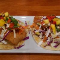 Baja Fish Tacos · Fried cod, lime crema, corn tortillas, and mango salsa. cabbage slaw