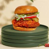 Cluckness Madness Sandwich · Spicy chicken breast seasoned to perfection, breaded, inside a toasted, buttered bun with pi...