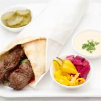 Kofta Kabob · Ground beef mixed with parsley and onions skewered and charbroiled, Mediterranean salad. Ser...