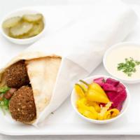 Falafel · Falafel tahini sauce, Mediterranean salad, hummus pickles served on tandoori bread or pita b...