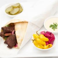 Lamb Kabob · Filet mignon chunks skewered and charbroiled hummus, Mediterranean salad served on tandoori ...