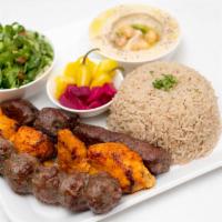 Combo Kabob · Three skewers of chicken kabob, kofta kabob, and filet mignon, rice, hummus, pickles, Medite...