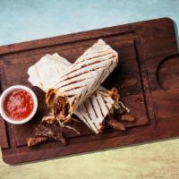 Beef Bad Boy Wrap Sandwich · Succulent beef kebabs served in a pita bread, with a side salad.