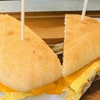 Sunrise Sandwich · your choice of bacon or ham, cage-free egg omelet, hash browns, mozzarella and cheddar on a ...