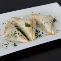 Spanakopita (3 Pieces) · Fresh spinach, feta, ricotta & cream cheeses with Greek herbs wrapped in phyllo dough & oven...