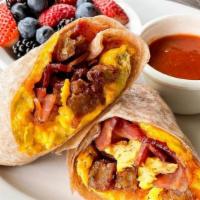 Breakfast Burrito · Eggs scrambled with diced potato pancakes, bacon, cheddar cheese, and wrapped in a whole whe...