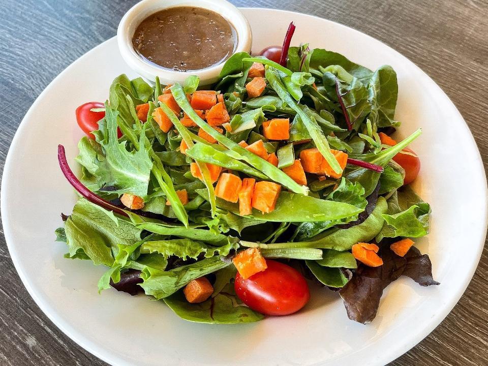 House Salad · Organic mixed lettuce with carrots, tomato, julienned snow peas and balsamic vinaigrette dressing.  Vegan, and vegetarian. Can be gluten free.