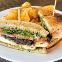 Chicken Pesto Sandwich · Grilled chicken breast with melted mozzarella, pesto, sliced tomato, grilled red onions, mix...