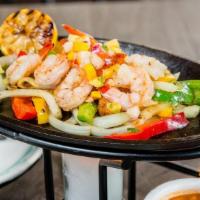 Shrimp Fajitas · Chipotle-garlic marinated shrimp. Served with rice, refired beans, guacamole, pico de gallo ...
