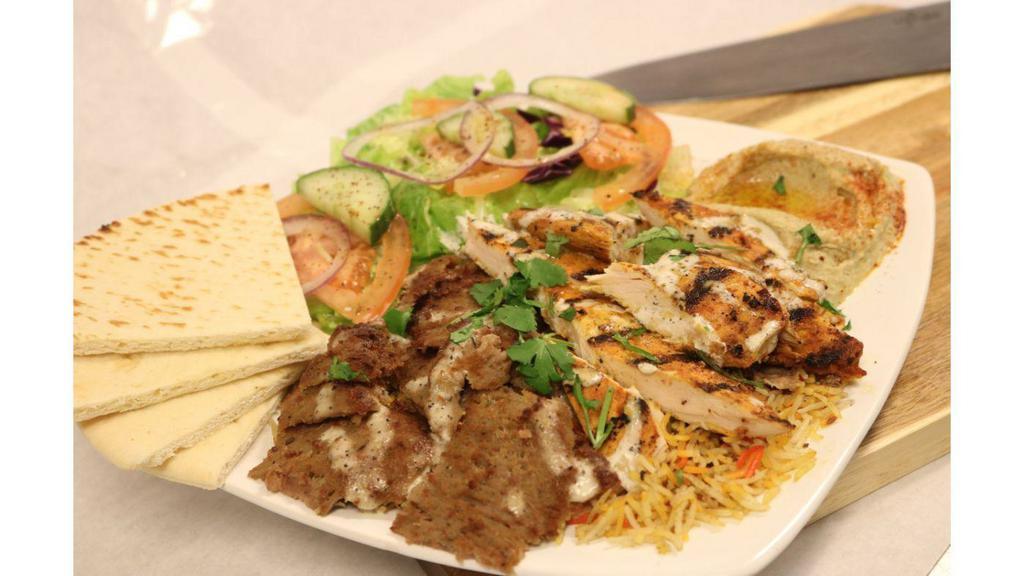 Combo Platter · Chicken, gyro, salad, rice, tzatziki, hummus, pita bread.