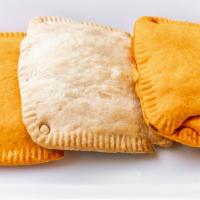 Jamaican Veggie Patty · Traditional Jamaican pastry with various fillings inside a flaky shell.