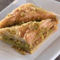 Baklava · Buttery layers of phyllo dough filled with nuts and lightly topped in floral syrup.