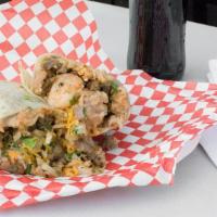 Monster Burrito · Asada, shrimp, beans, rice ,monster sauce, cheese, avocado and onions, cilantro.