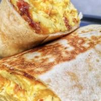 (New) Breakfast Burrito · Keeping it simple -- Eggs, Roasted Potatoes & Cheddar Cheese served with a side of salsa ver...