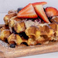 Very Berry Waffles · 2 Liege Waffles layered with house-made ricotta & berry jam topped with
fresh strawberries &...