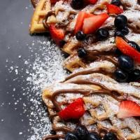 Classic Waffles · 2 Liege Waffles layered topped with strawberries, powdered sugar and Nutella!