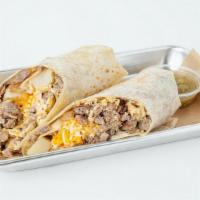 Steak & Egg Breakfast Burrito · Eggs, skirt steak, jack cheese, rosemary potatoes and pico de gallo wrapped in a flour torti...