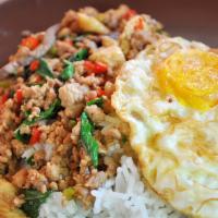 Kra Prao With Egg Over Rice · Stir fried meat with basil, chili, and garlic served over rice with fried egg. Hot and spicy.