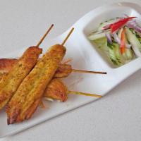 Satay · Skewered slices of marinated beef, chicken or tofu served with peanut sauce and cucumber sal...