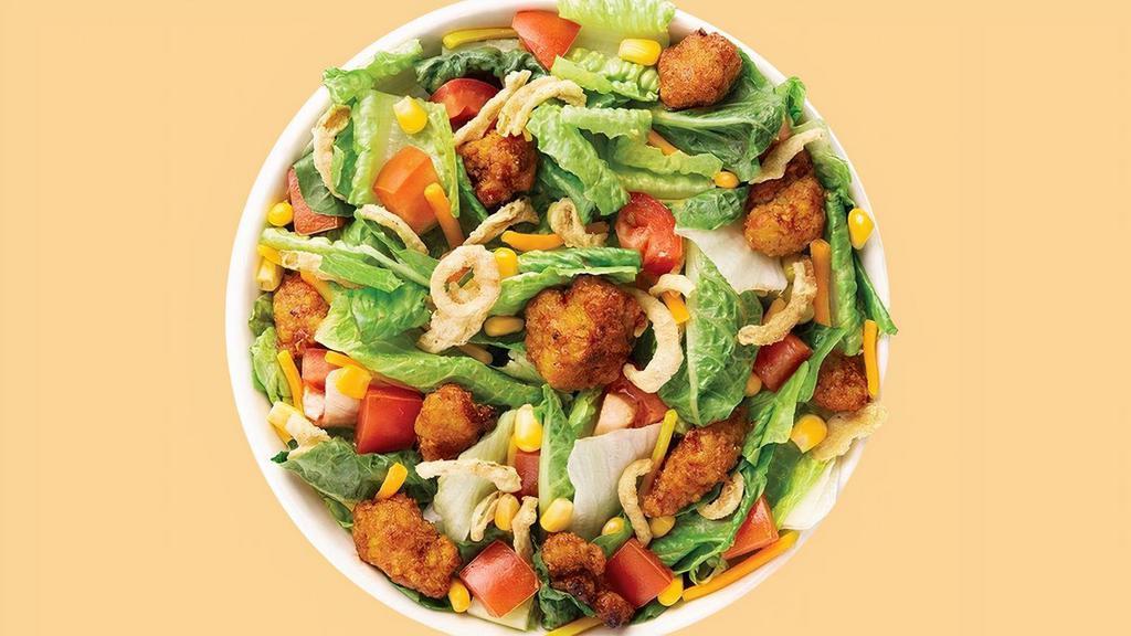 Smoky Bbq Crispy Chicken Salad · This Chef-inspired Signature starts with a recommended base of Romaine/Iceberg Blend. It is served with Smoky BBQ Crispy Chicken, Diced Tomatoes, Sweet Corn, Cheddar Cheese and Onion Crisps. We recommend our Ranch dressing.