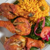 Pollo Frito  · Dominican style fried chicken drumsticks served with arroz con gandules or arroz blanco