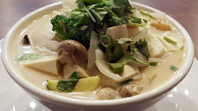 Tom Kha · Vegan. White mushroom, Thai herbs and onion in coconut soup choice of chicken, organic tofu or shrimp or seafood for additional charge.