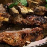 Rack Of Lamb · Gluten-free.  Australian lamb rack marinated in hung yogurt and exotic spices skewered in cl...