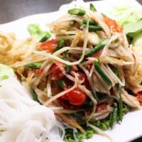 Bk'S Special Papaya Salad · Shredded young papaya, green beans, thai eggplants, and tomatoes with your choice of Lao or ...