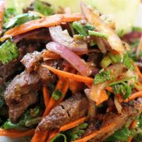 Yum Nua (Steak Salad) · Our most popular grilled steak salad (Yum Nua) cooked to a medium, sliced and tossed with ca...