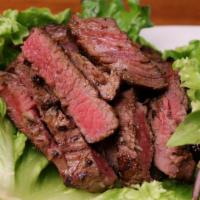 Namtoke · Sliced grilled steak marinated in our house seasoning served with lettuce, cilantro and spic...