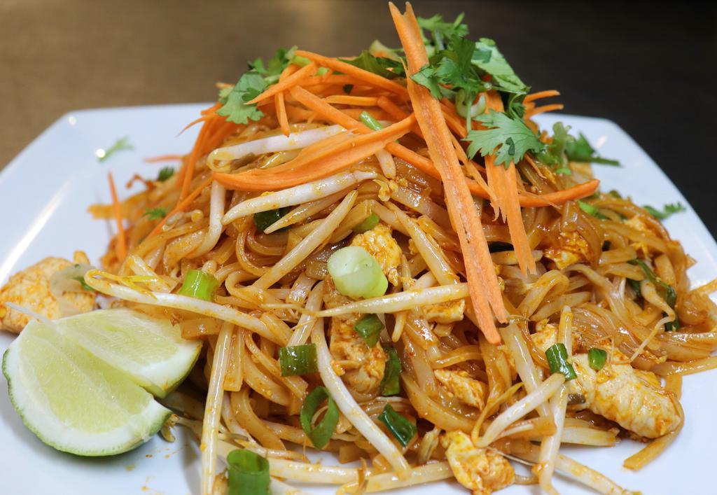 Pad Thai (Red Sauce) · Rice noodles, eggs, bean sprouts, green onions, hint of tamarind cooked in a smokey paprika sauce.