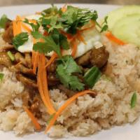 Khao Koung Kapi (Shrimp Paste Fried Rice) · Shrimp-based fried rice topped with sweet pork and egg over easy. Garnished with green onion...